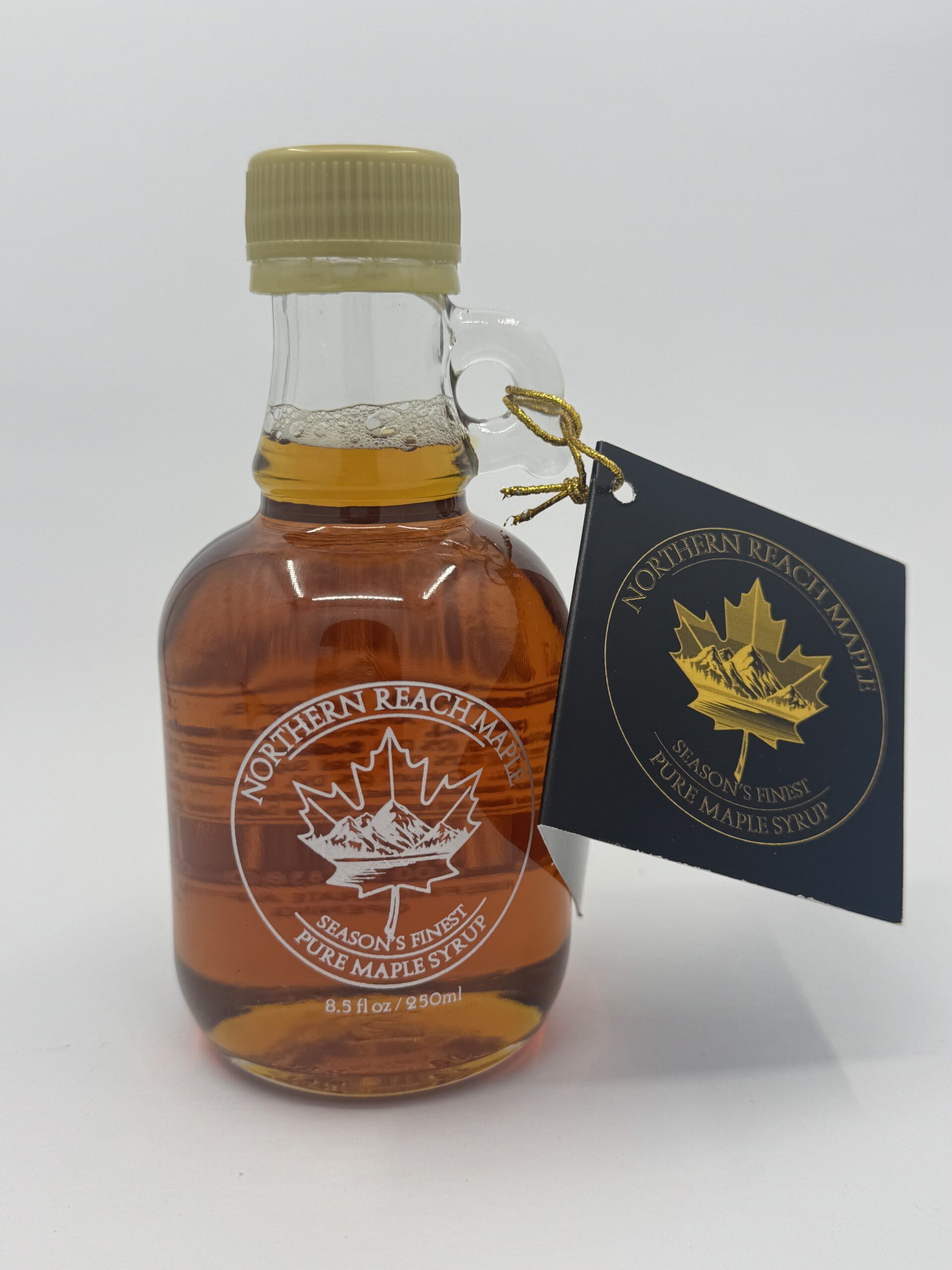 A bottle of Season's Finest Pure Maine Maple Syrup. Our best pure maine maple syrup.