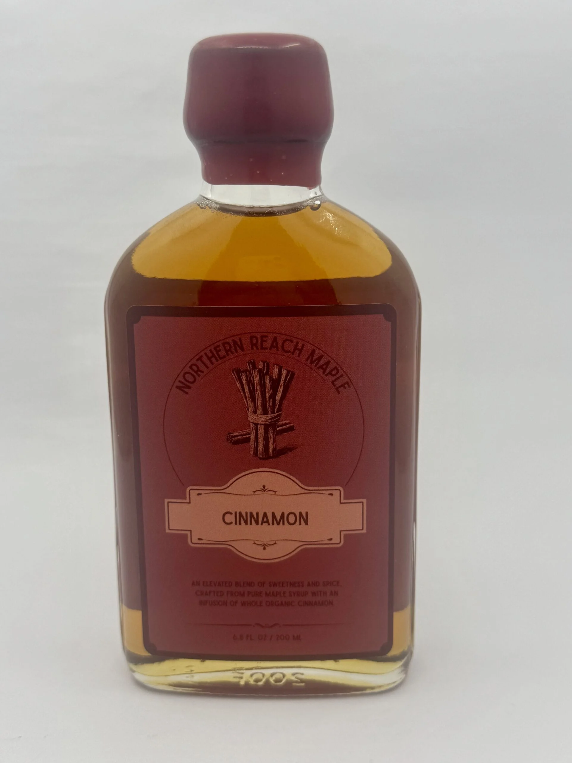 A bottle of cinnamon infused maple syrup