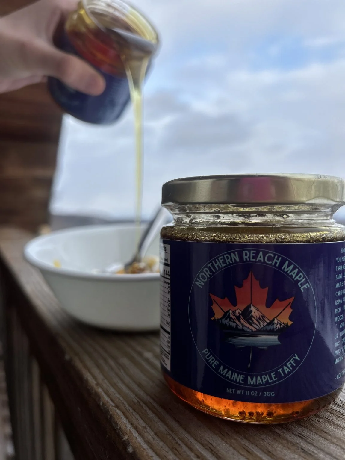 Warmed pure Maine maple taffy being poured over vanilla ice cream.