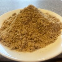 A plate holding Northern Reach Maple's Pure Maine Maple Sugar