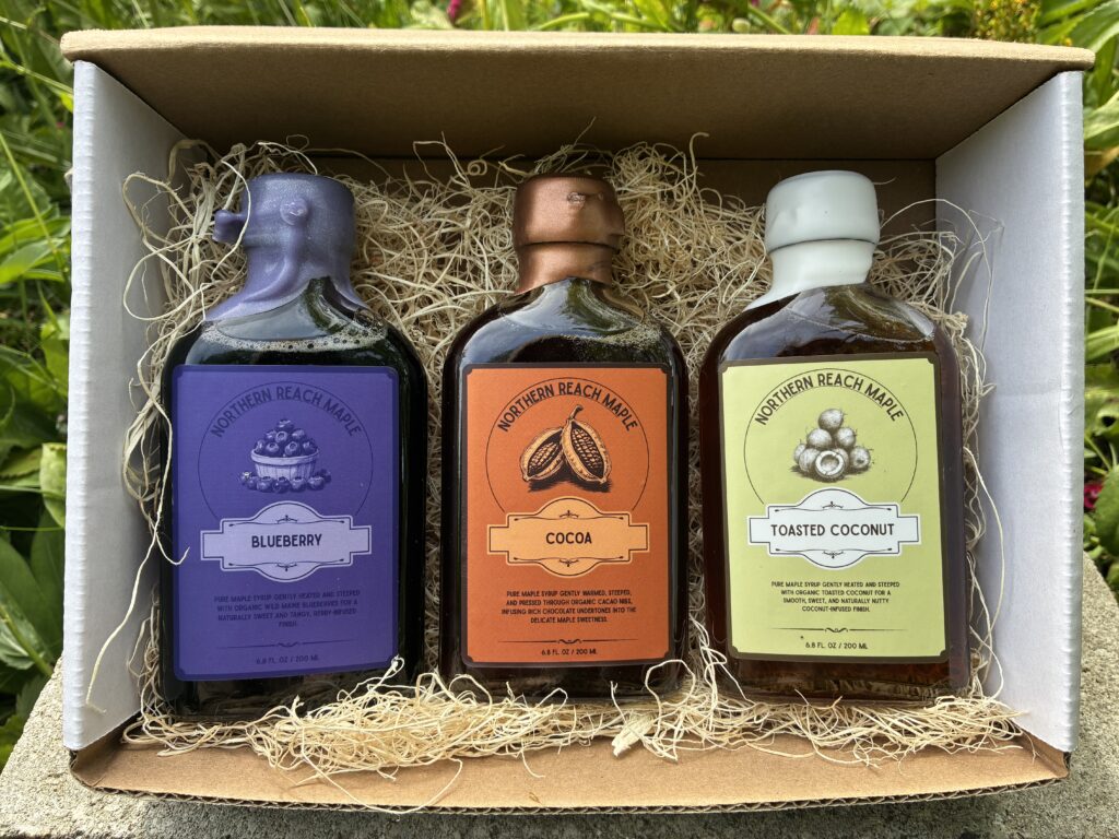 Berry, Cocoa, and Copra maple flavor trio pictured in a mailer box.